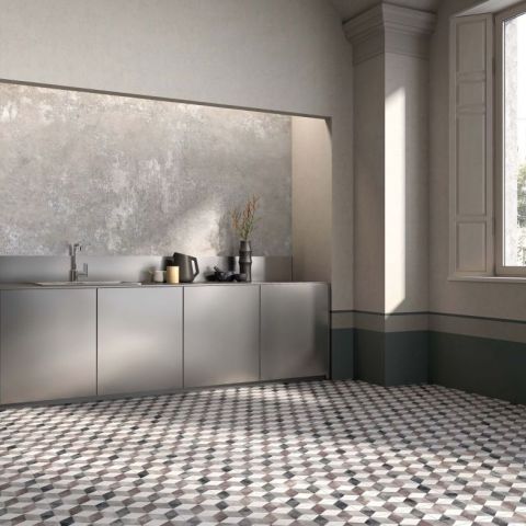 Designküche im minimalistischen Stil mit edlen Oberflächen und Fliesenmuster Moderne minimalistische Küche mit grauen Schränken, strukturierter Wand und geometrischem Bodenmuster